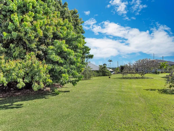 a view of a swimming pool with a table and chairs