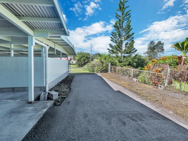 an aerial view of residential building with parking space