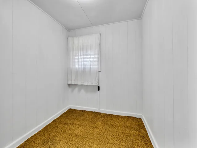 a bathroom with a tub and window