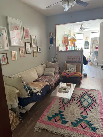 a living room with furniture and a window
