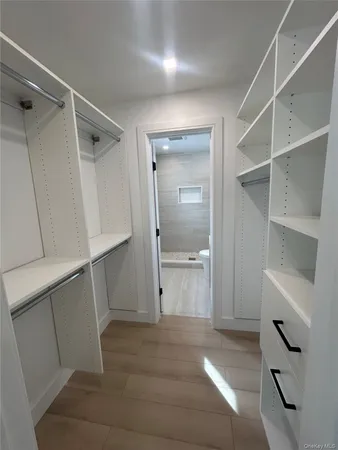 a view of an empty walk in closet