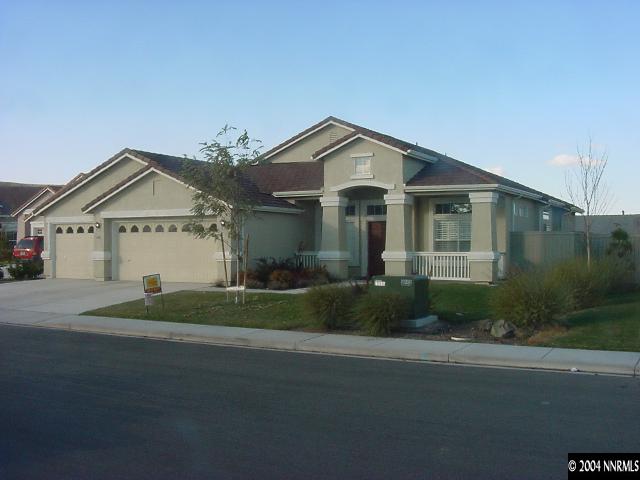 1743 Big Boulder Court Reno, NV 89521 - Photo 1 of 5 a front view of a house with a yard and garage