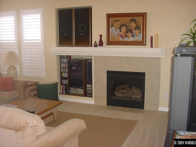 1743 Big Boulder Court Reno, NV 89521 - Photo 3 of 5 a living room with furniture a fireplace and window