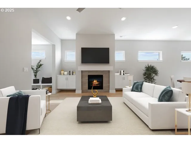 a living room with furniture a flat screen tv and a fireplace