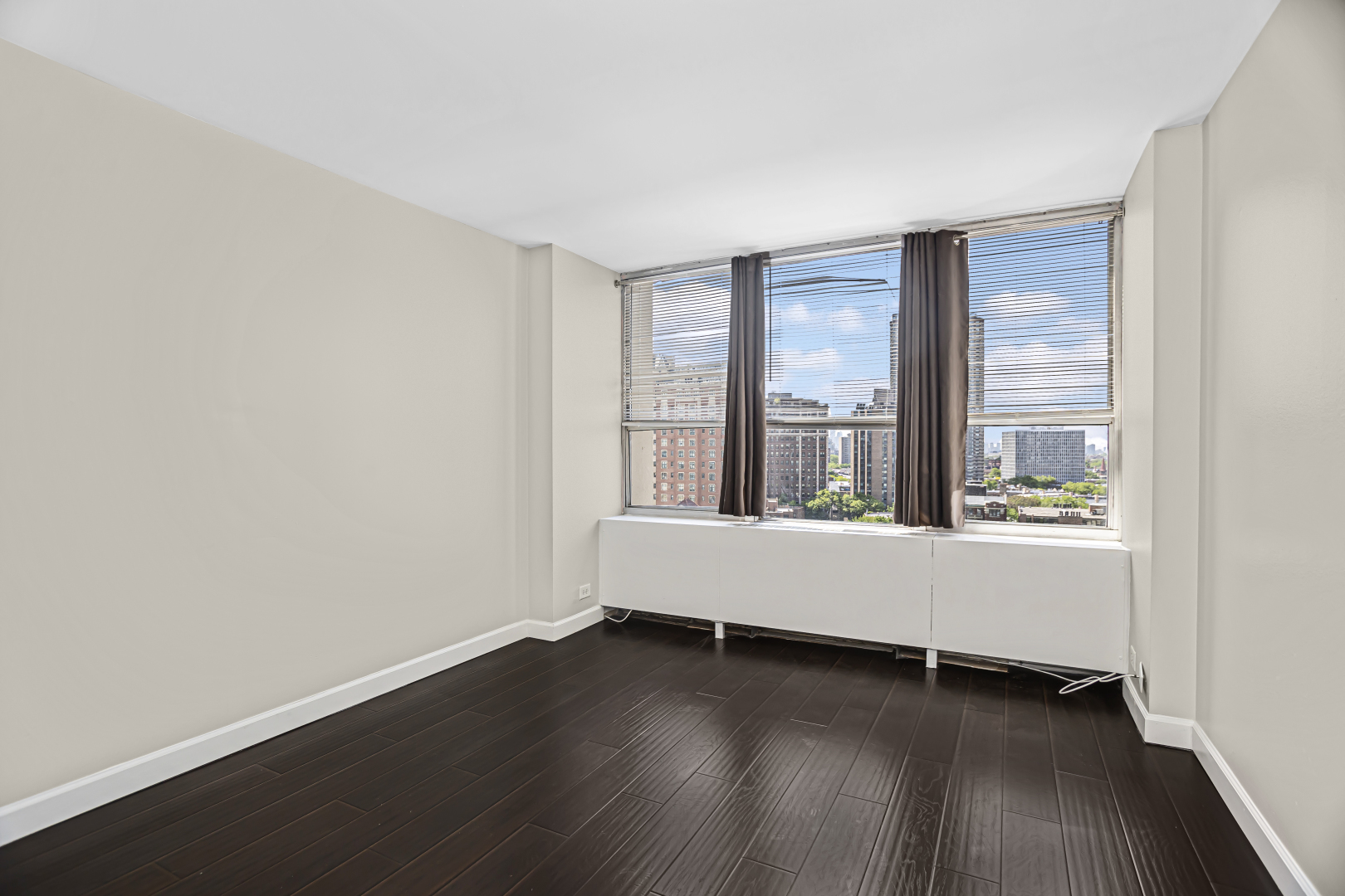 655 West Irving Park Road, Unit 1201 Chicago, IL 60613 - Photo 17 of 25 an empty room with wooden floor and a window