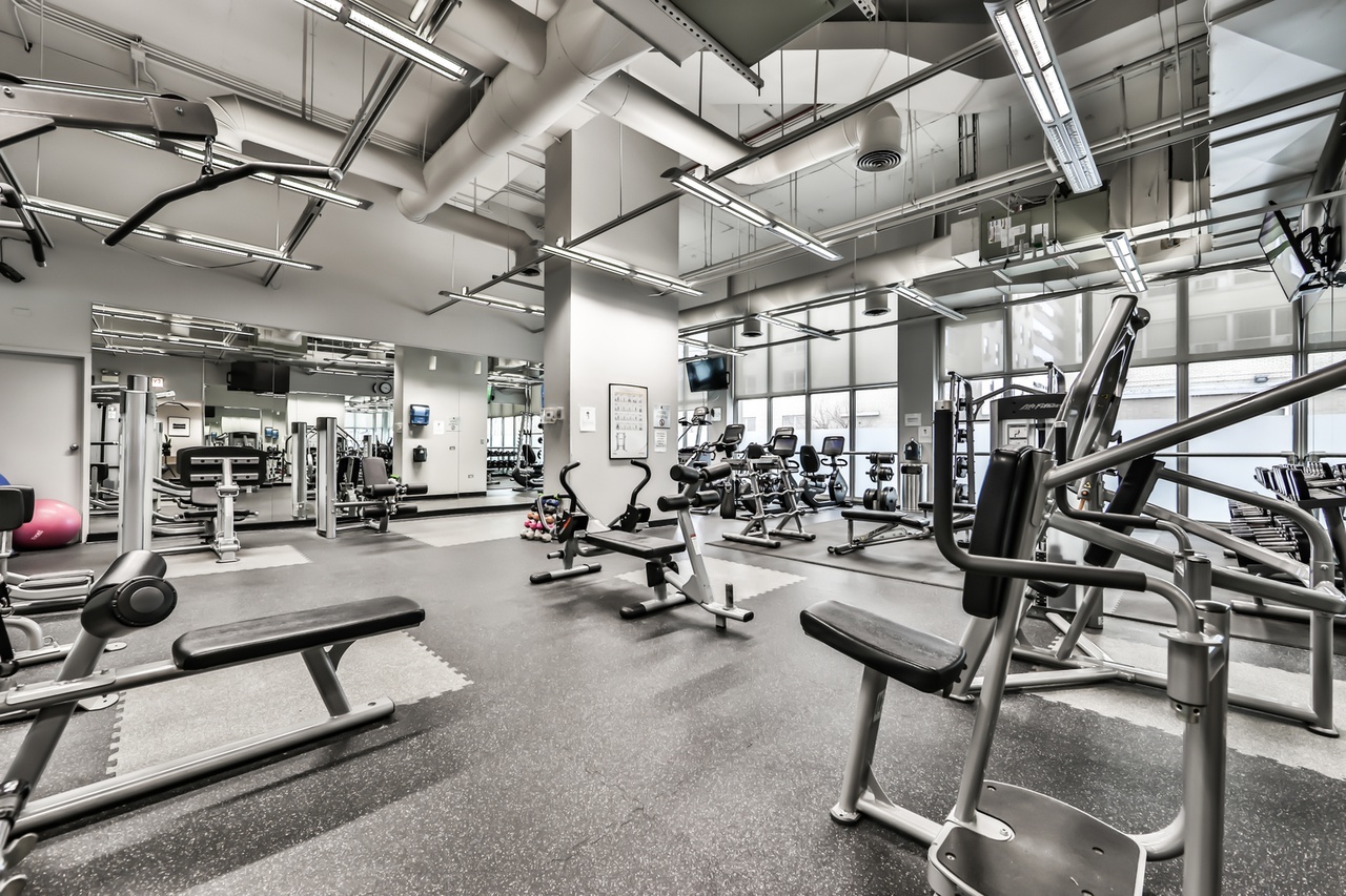 655 West Irving Park Road, Unit 1201 Chicago, IL 60613 - Photo 22 of 25 a view of a room with gym equipment