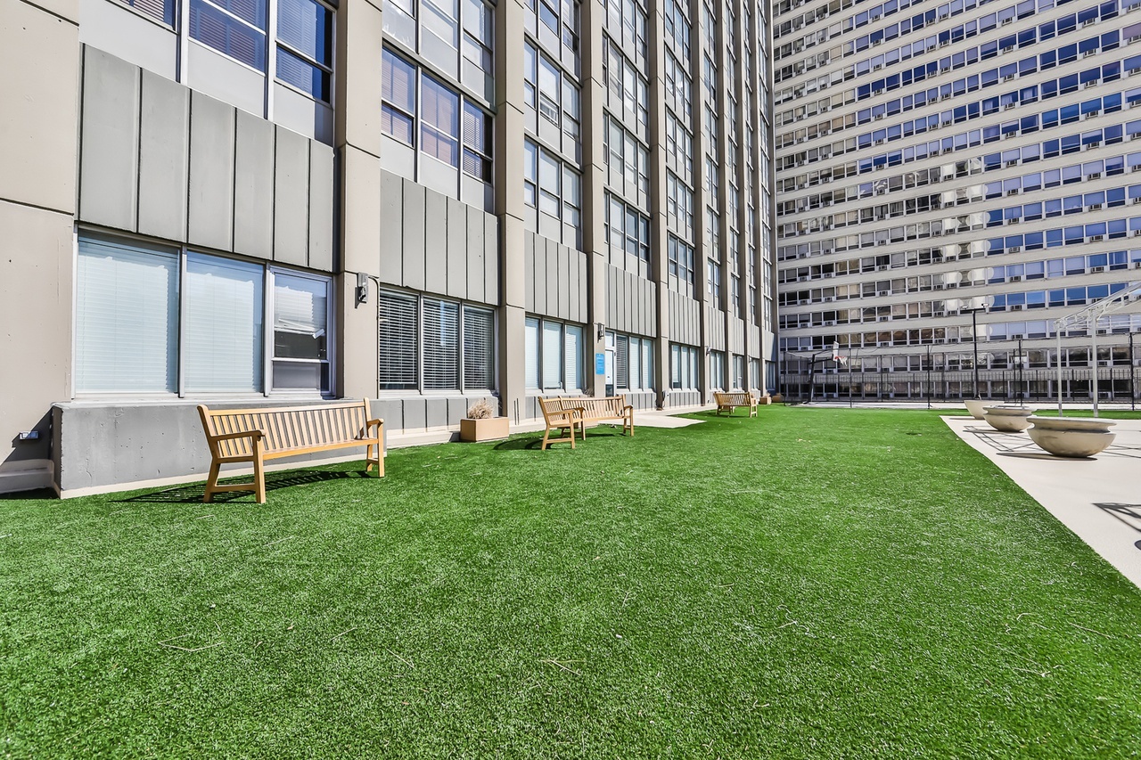 655 West Irving Park Road, Unit 1201 Chicago, IL 60613 - Photo 24 of 25 a garden with tall trees