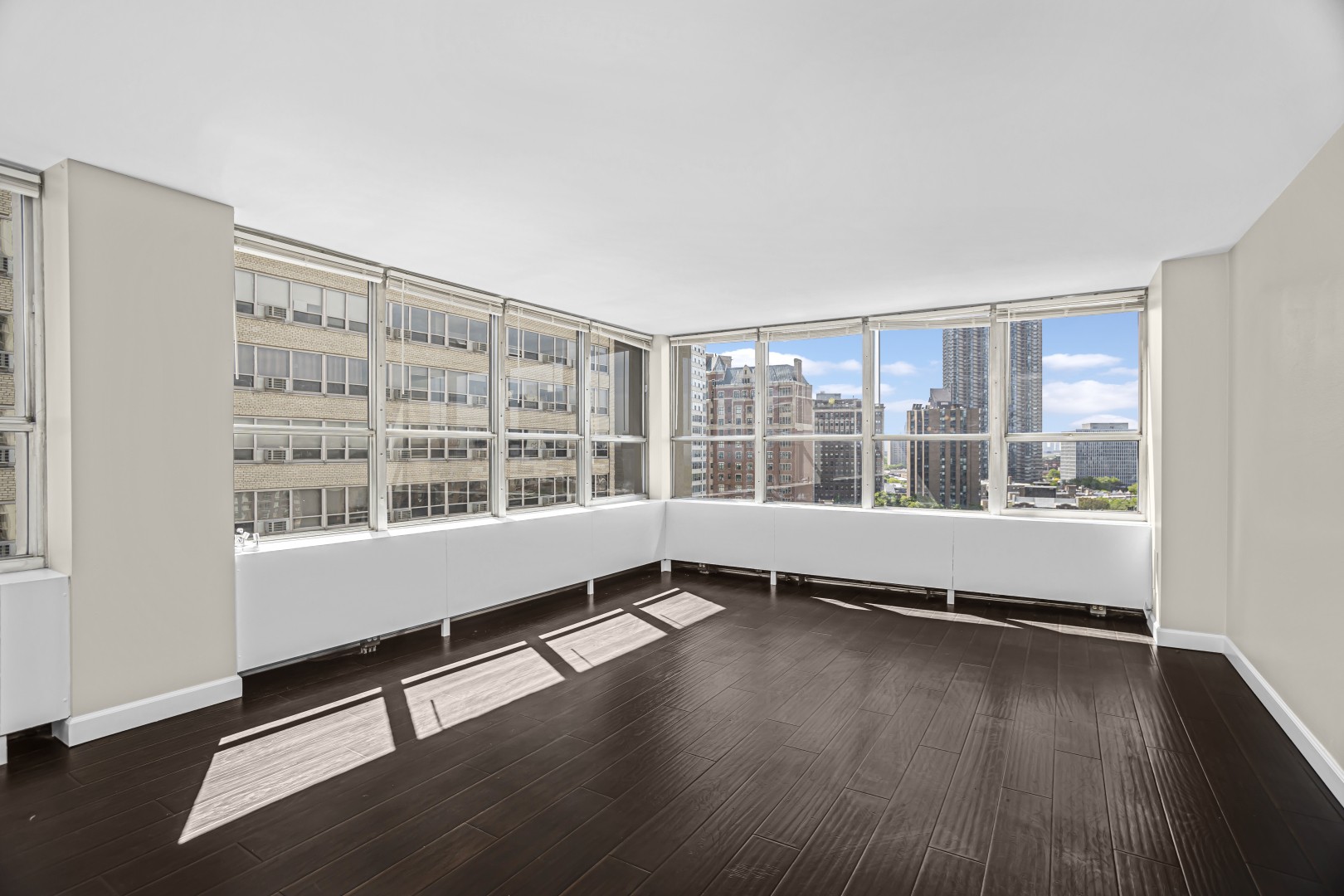 655 West Irving Park Road, Unit 1201 Chicago, IL 60613 - Photo 7 of 25 wooden floor in an empty room with a window
