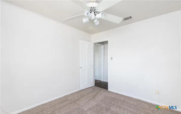 a view of a hallway with staircase