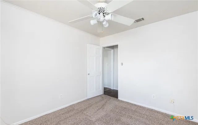a view of a hallway with staircase