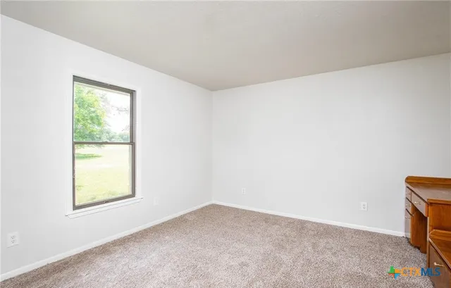 a view of a big room with wooden floor and closet