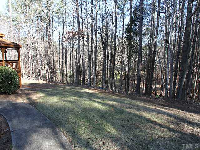 2504 Barton Ridge Court Raleigh, NC 27613 - Photo 21 of 25 This landscaped yard is surrounded in privacy with the hardwood trees. Back Yard