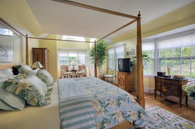 9 North Bay Road Osterville, MA 02655 - Photo 11 of 25 a bedroom with a bed and large windows