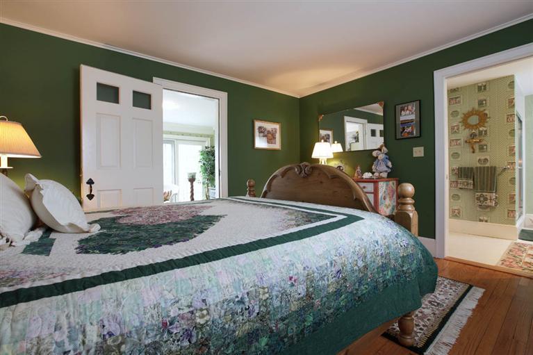 9 North Bay Road Osterville, MA 02655 - Photo 14 of 25 a bedroom with a bed and wooden floor