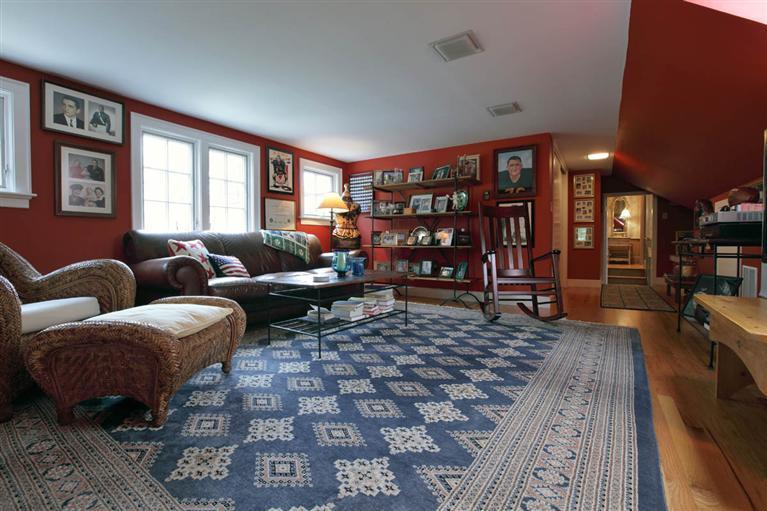 9 North Bay Road Osterville, MA 02655 - Photo 17 of 25 a living room with furniture a rug and a bookshelf