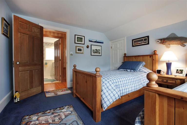 9 North Bay Road Osterville, MA 02655 - Photo 18 of 25 a bedroom with a bed and wooden floor