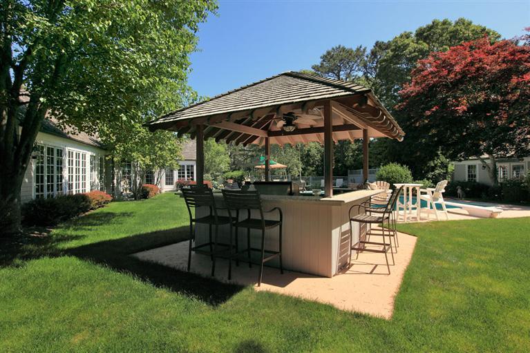 9 North Bay Road Osterville, MA 02655 - Photo 22 of 25 a view of a chair and table in the garden