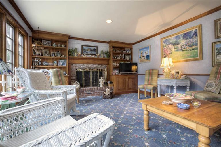 9 North Bay Road Osterville, MA 02655 - Photo 10 of 25 a living room with furniture a rug and a fireplace