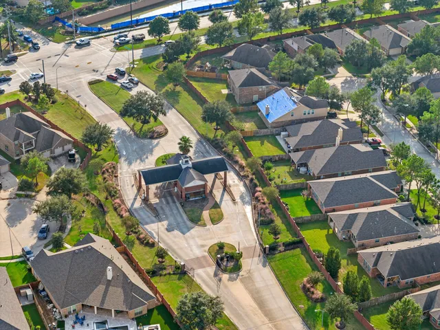 an aerial view of a house with yard swimming pool and outdoor seating