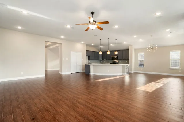 a view of a kitchen with a sink and microwave