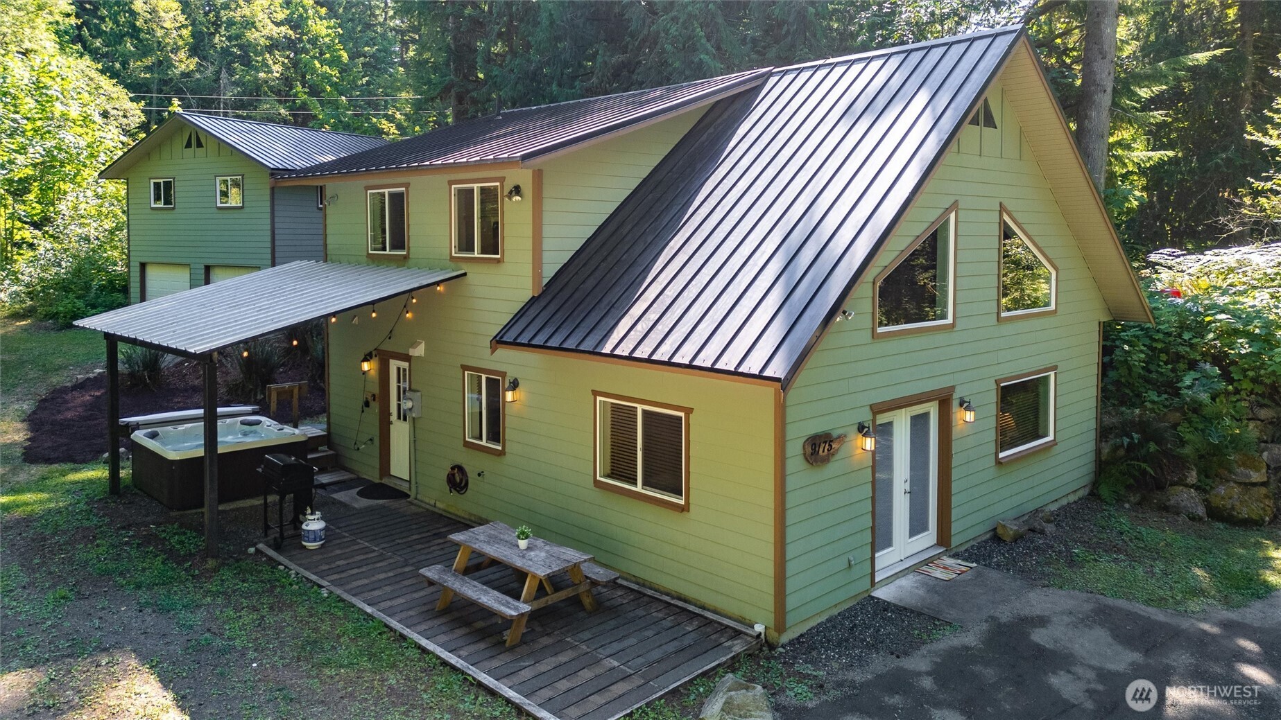 a view of house with a chairs in patio