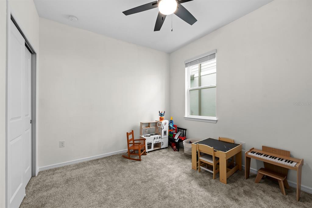 20402 Monza Loop Land O Lakes, FL 34638 - Photo 17 of 36 a room with a window