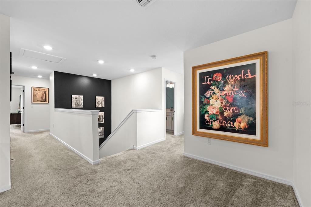 20402 Monza Loop Land O Lakes, FL 34638 - Photo 18 of 36 a view of a hallway with workspace