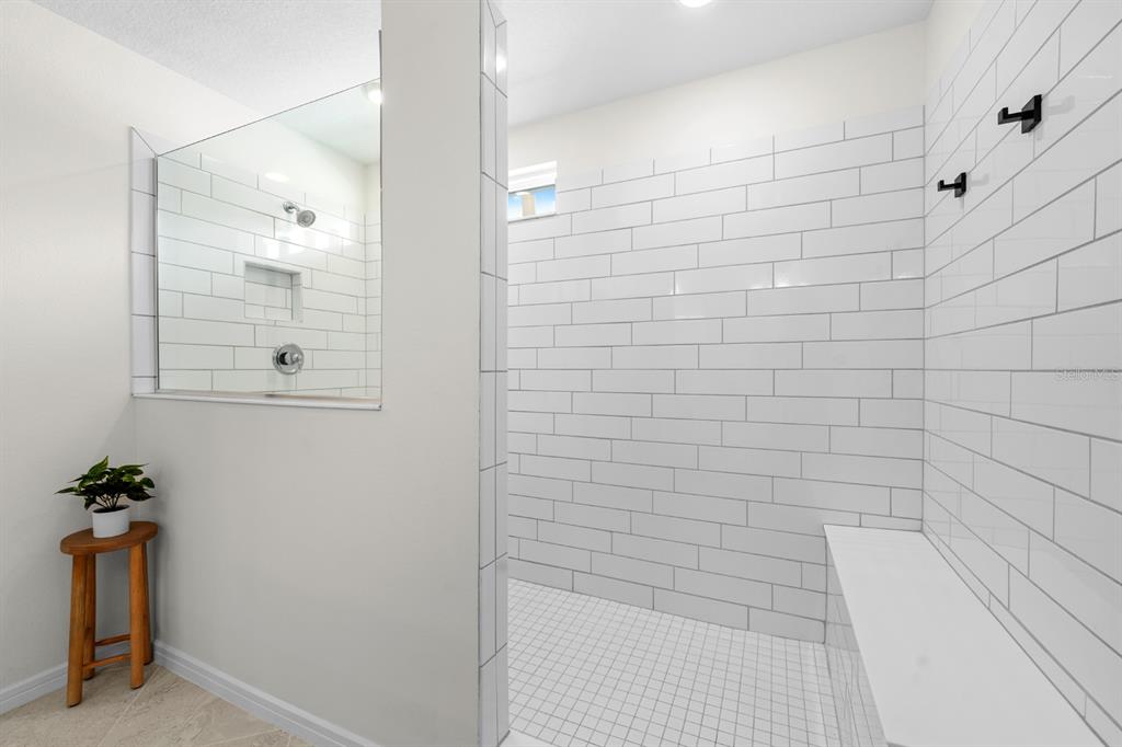 20402 Monza Loop Land O Lakes, FL 34638 - Photo 28 of 36 a bathroom with a shower
