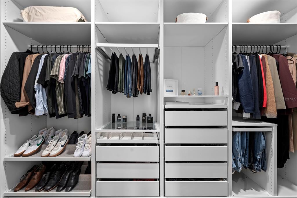 20402 Monza Loop Land O Lakes, FL 34638 - Photo 29 of 36 a view of walk in closet with clothes and shoes