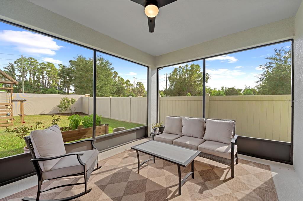 20402 Monza Loop Land O Lakes, FL 34638 - Photo 30 of 36 a balcony view with a large window and dining space