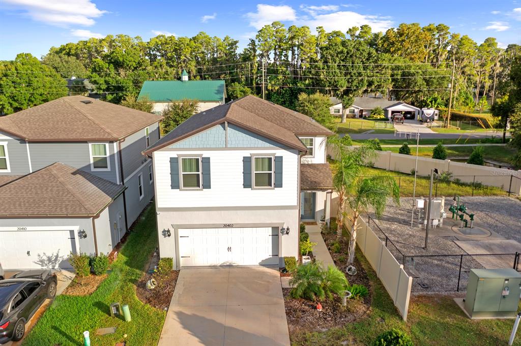 20402 Monza Loop Land O Lakes, FL 34638 - Photo 3 of 36 a aerial view of a house with a yard