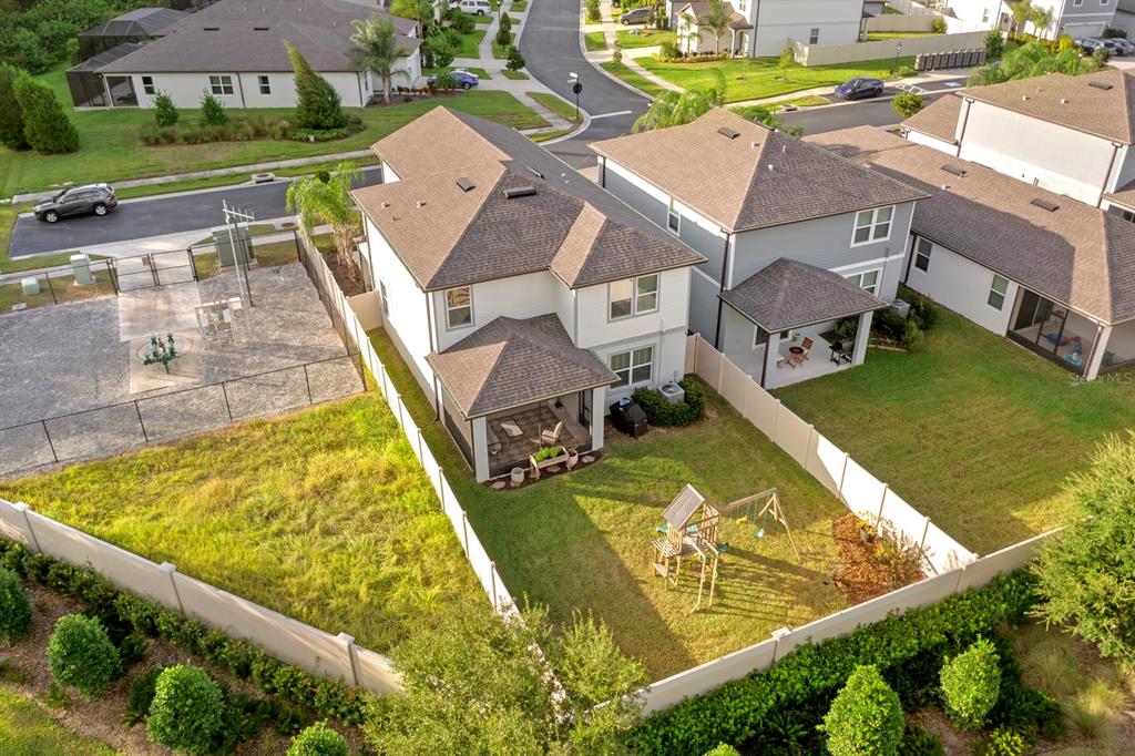 20402 Monza Loop Land O Lakes, FL 34638 - Photo 33 of 36 an aerial view of a house with a swimming pool