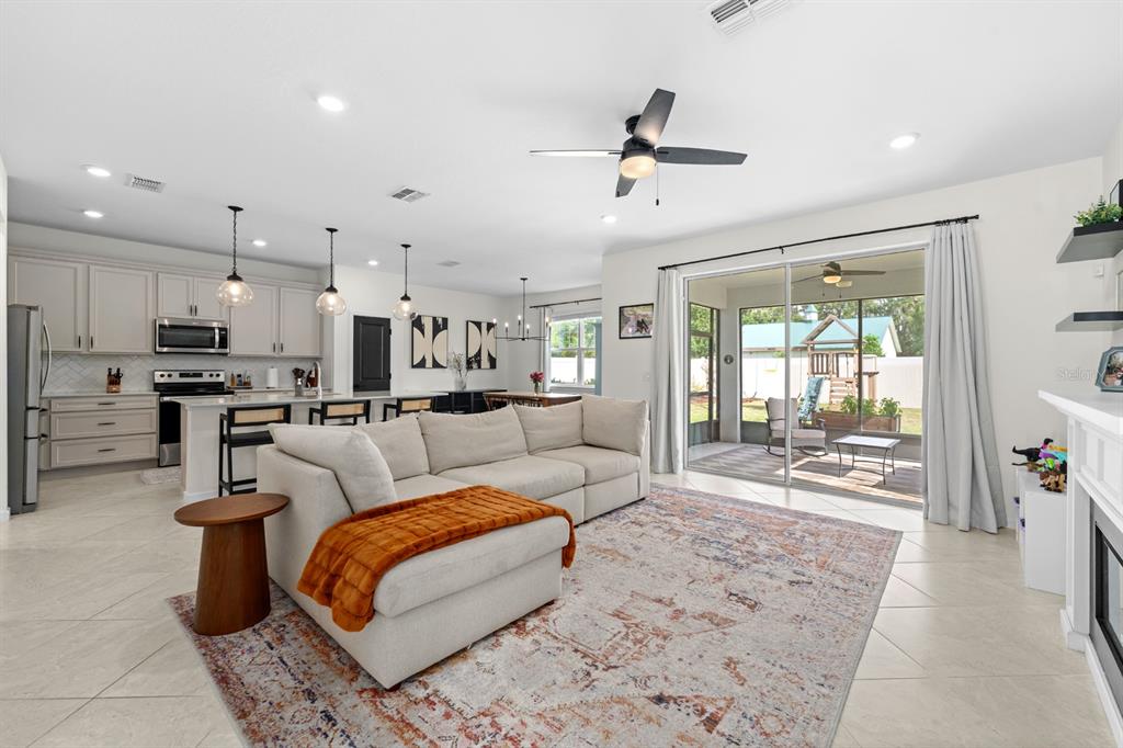 20402 Monza Loop Land O Lakes, FL 34638 - Photo 9 of 36 a living room with furniture and a large window