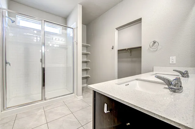 a view of a room with shelf on the wall