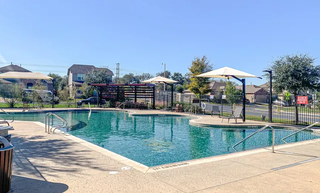 a view of a swimming pool with a patio