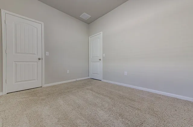 a view of workspace with window and a bathroom