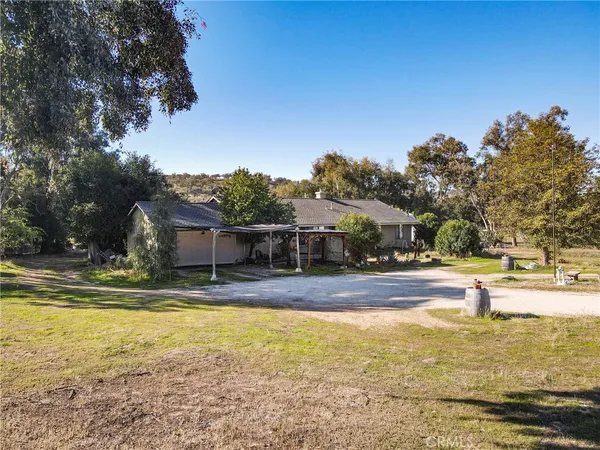a view of a house with swimming pool