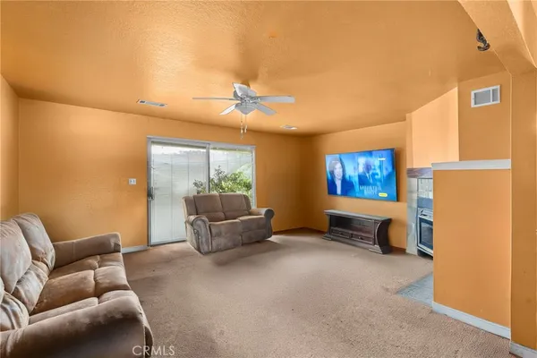 a living room with furniture and a window