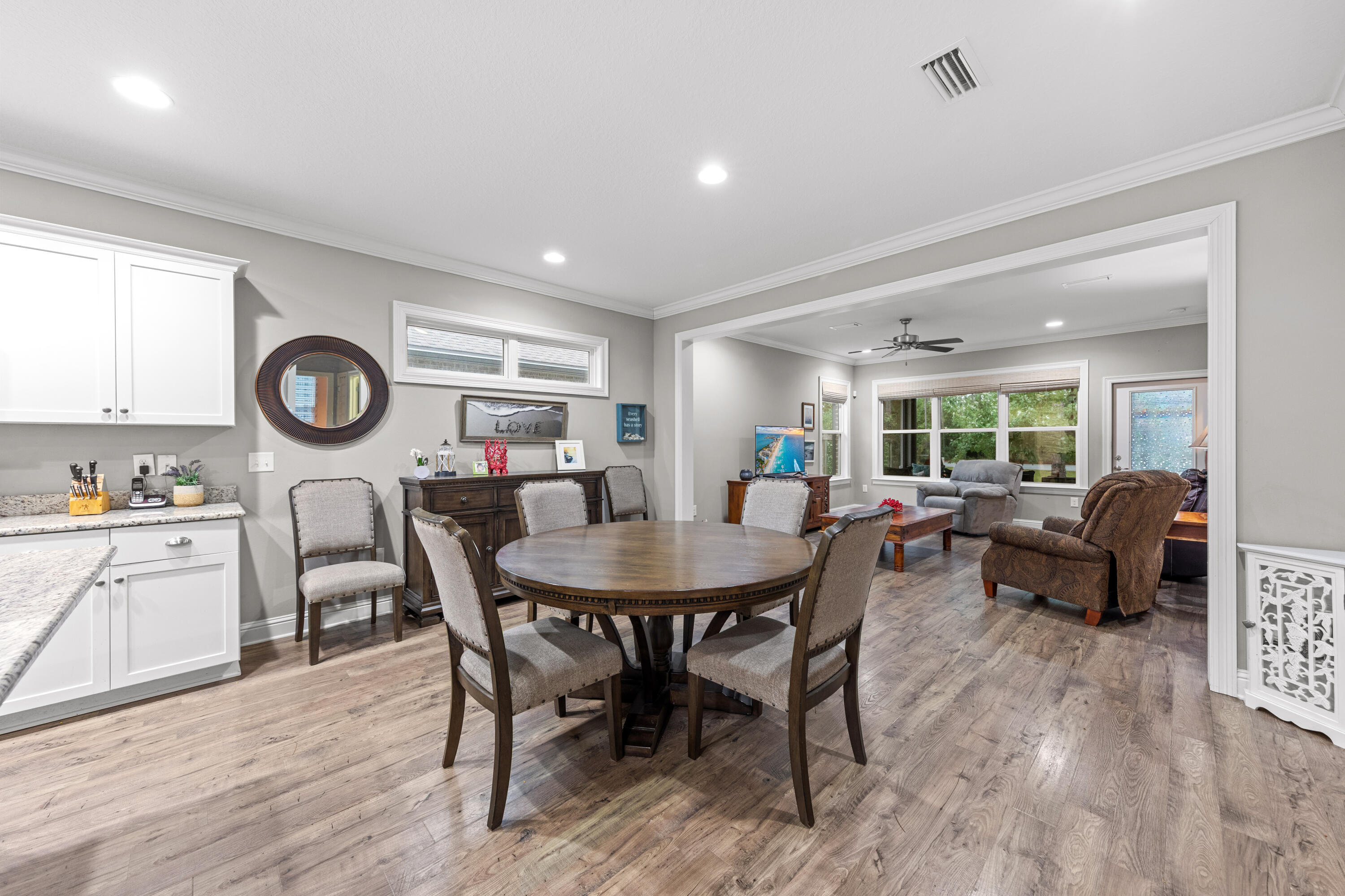 40 Oyster Boulevard Freeport, FL 32439 - Photo 11 of 30 a view of a dining room with furniture and wooden floor