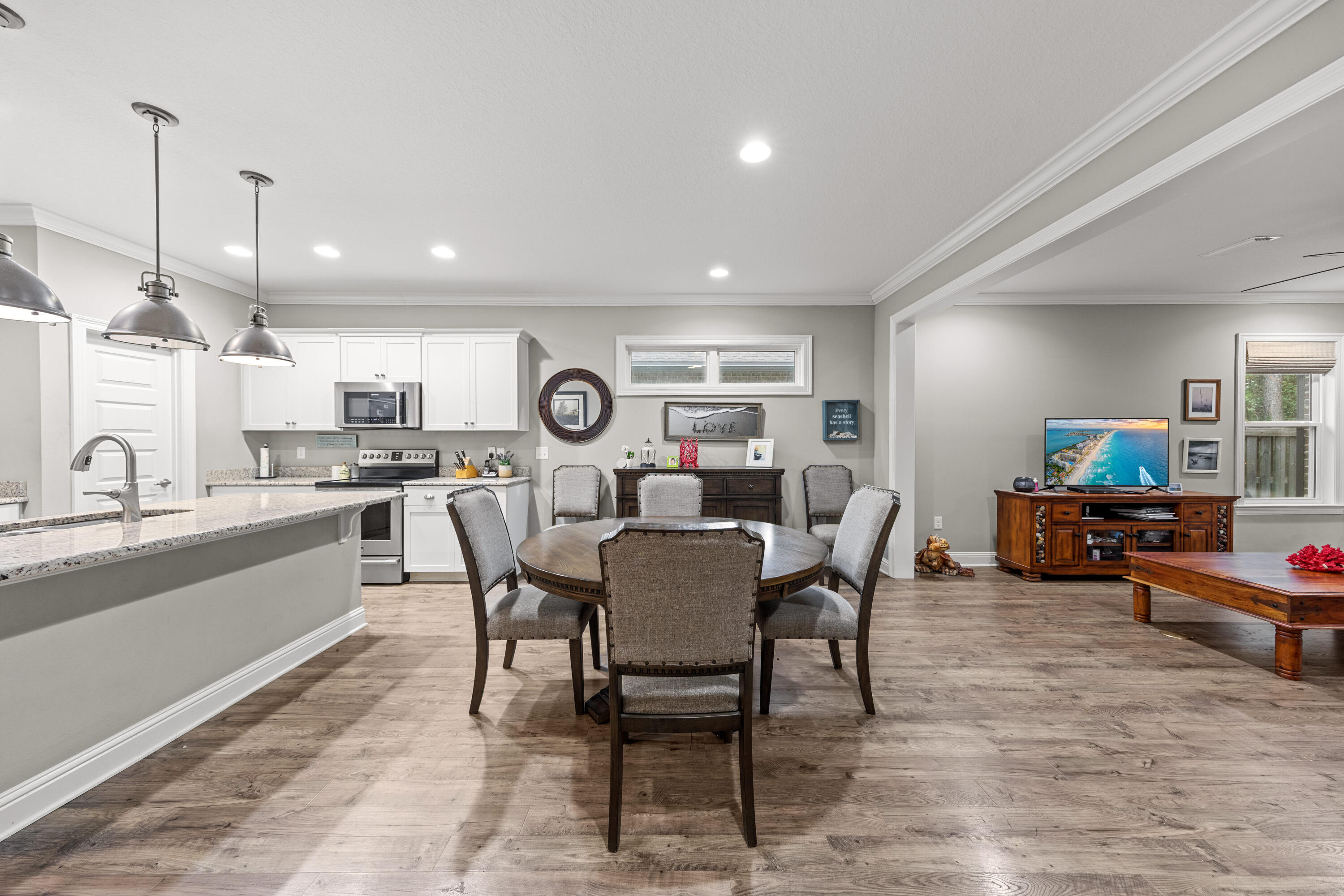 40 Oyster Boulevard Freeport, FL 32439 - Photo 12 of 30 a view of a dining room with furniture and a kitchen