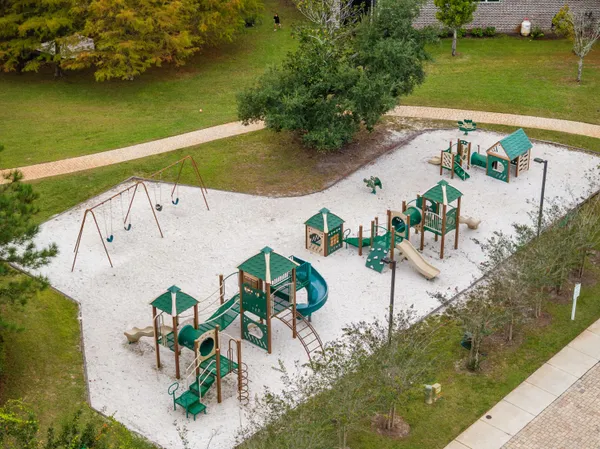 an aerial view of a house with outdoor space
