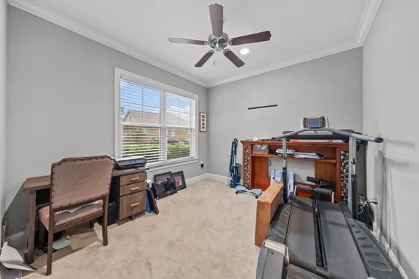 a bed room with furniture and a window