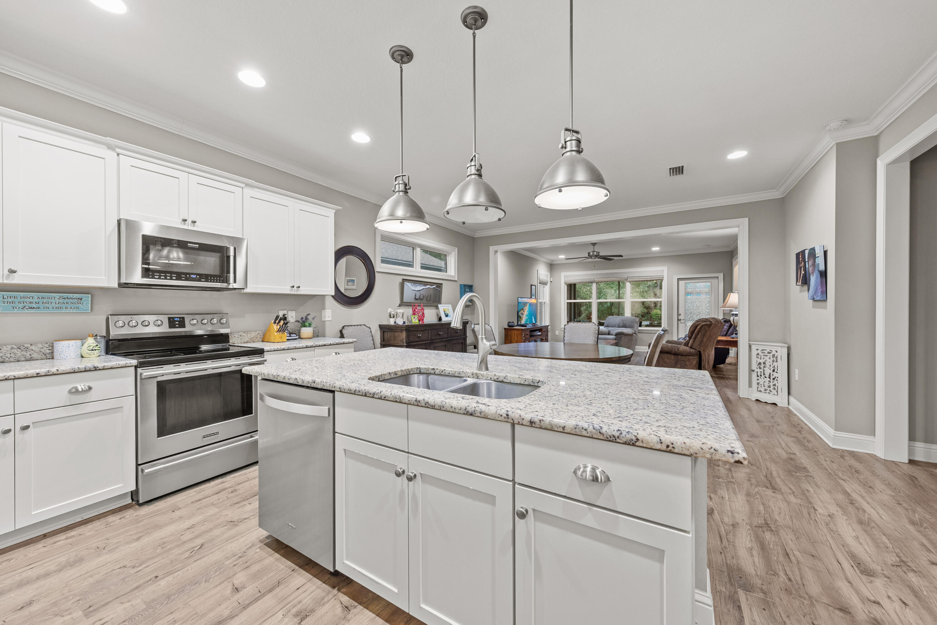40 Oyster Boulevard Freeport, FL 32439 - Photo 7 of 30 a kitchen with a sink stove and microwave