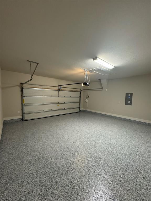 4123 Windy Point Court Oak Point, TX 75068 - Photo 27 of 29 Spacious garage featuring a durable speckled epoxy floor finish