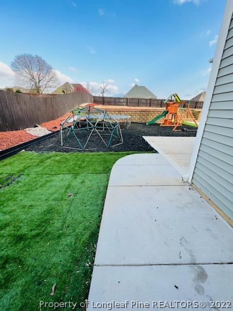 455 Heathrow Drive Spring Lake, NC 28390 - Photo 4 of 5 a view of a terrace with a garden