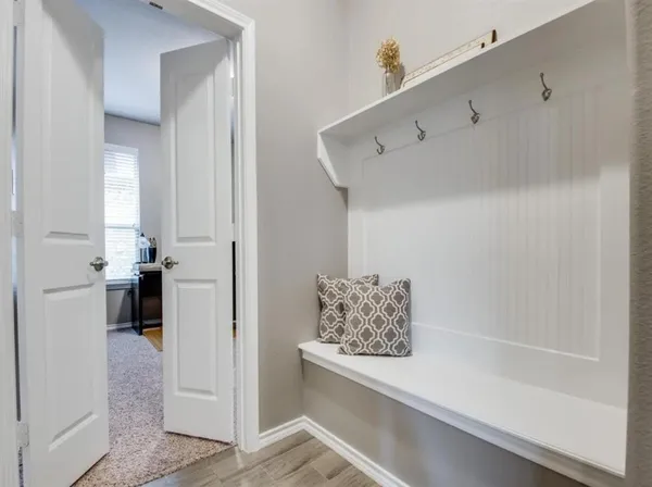 a view of room with window and hallway