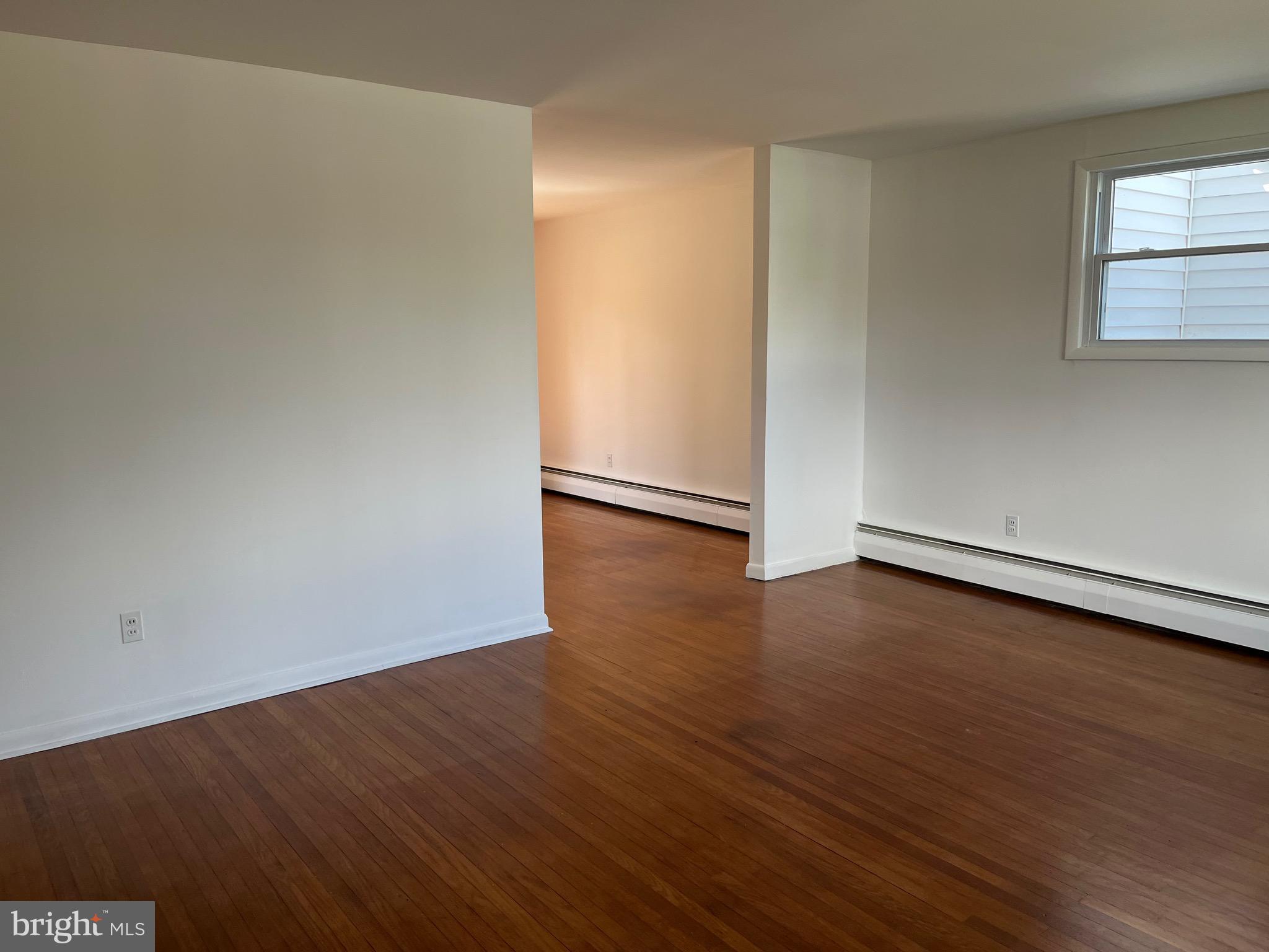 117 Spring Road Malvern, PA 19355 - Photo 17 of 25 an empty room with wooden floor