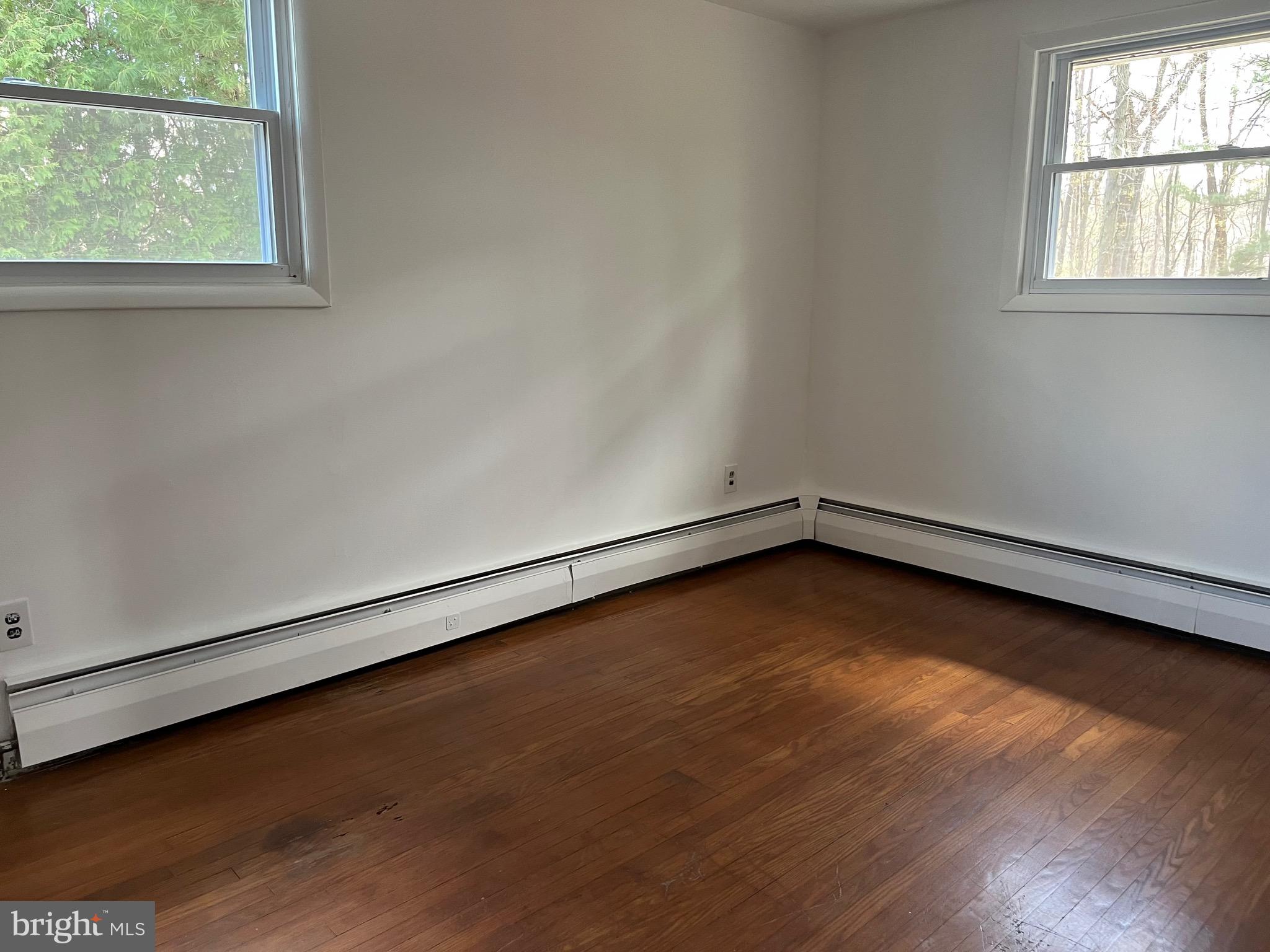 117 Spring Road Malvern, PA 19355 - Photo 23 of 25 a view of a room with wooden floor and window