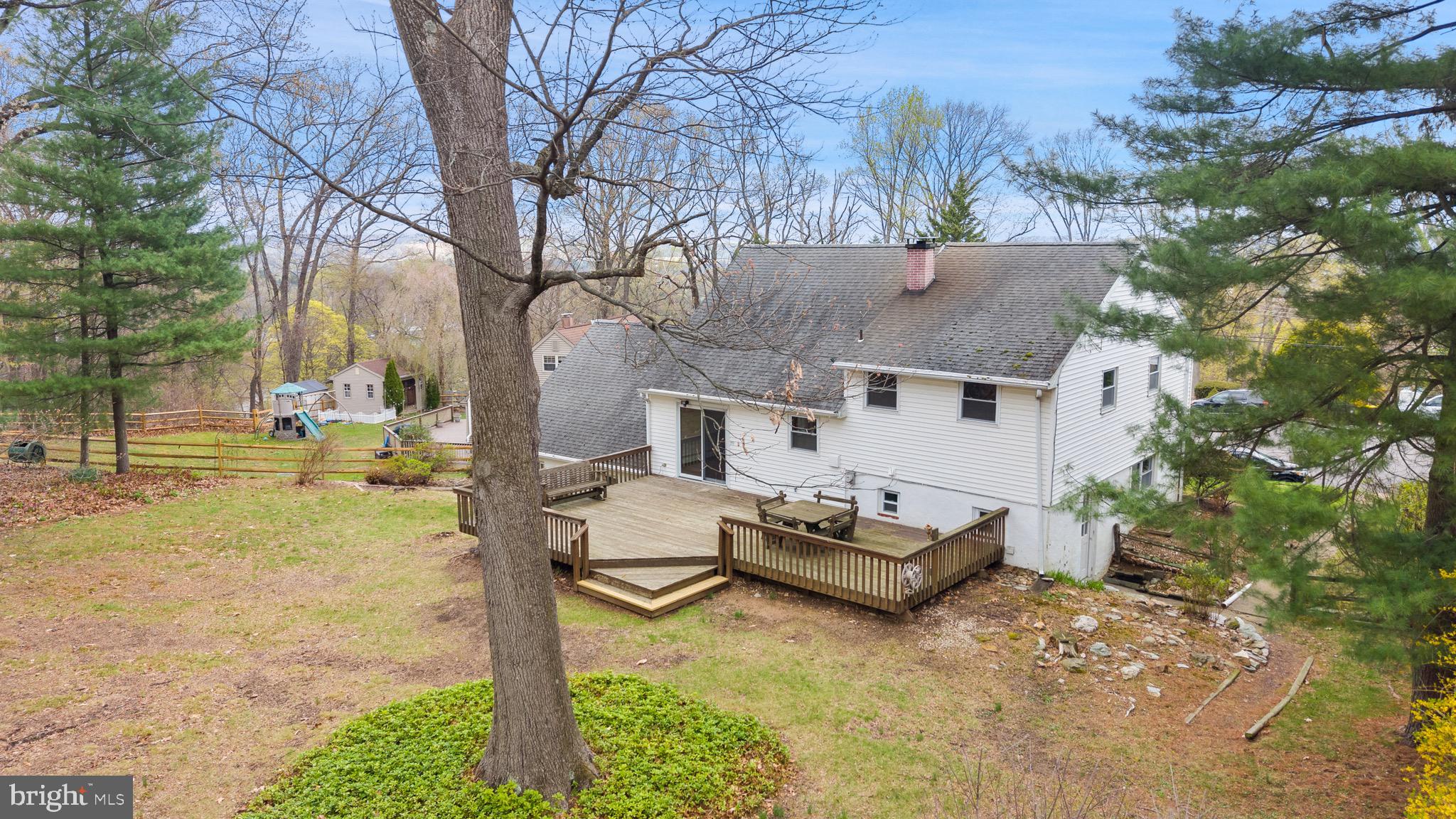 117 Spring Road Malvern, PA 19355 - Photo 4 of 25 a view of a house with backyard porch and sitting area