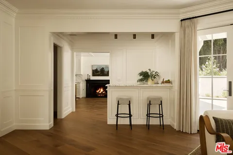 a bed room with a bed and a fireplace